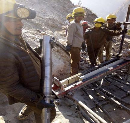 GSI crew drilling anchors for the barrier foundations